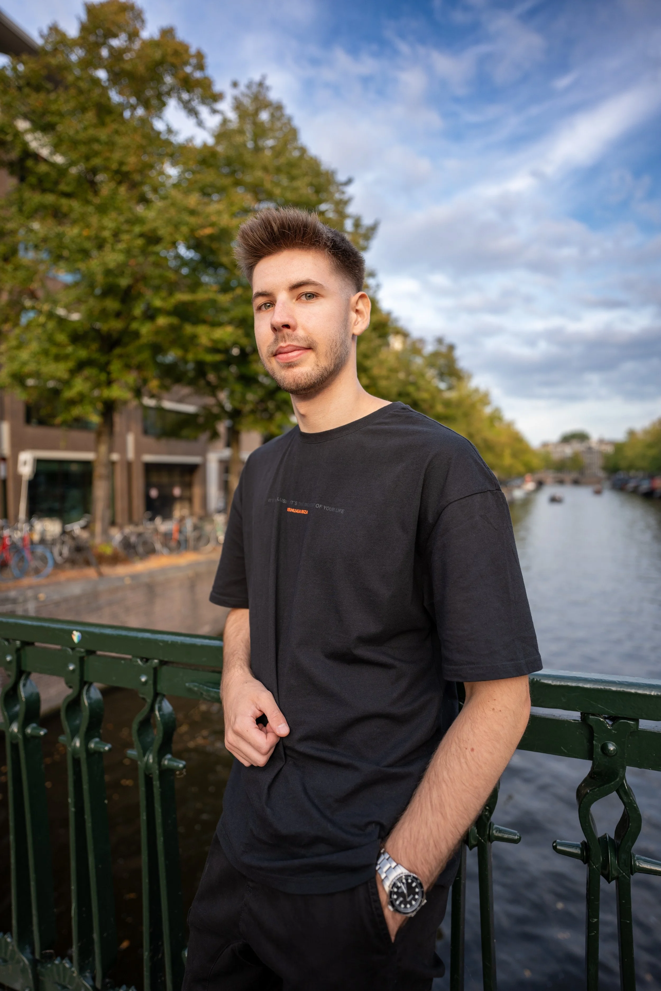 Tim Langner standing on a bridge over a canal in Hamburg